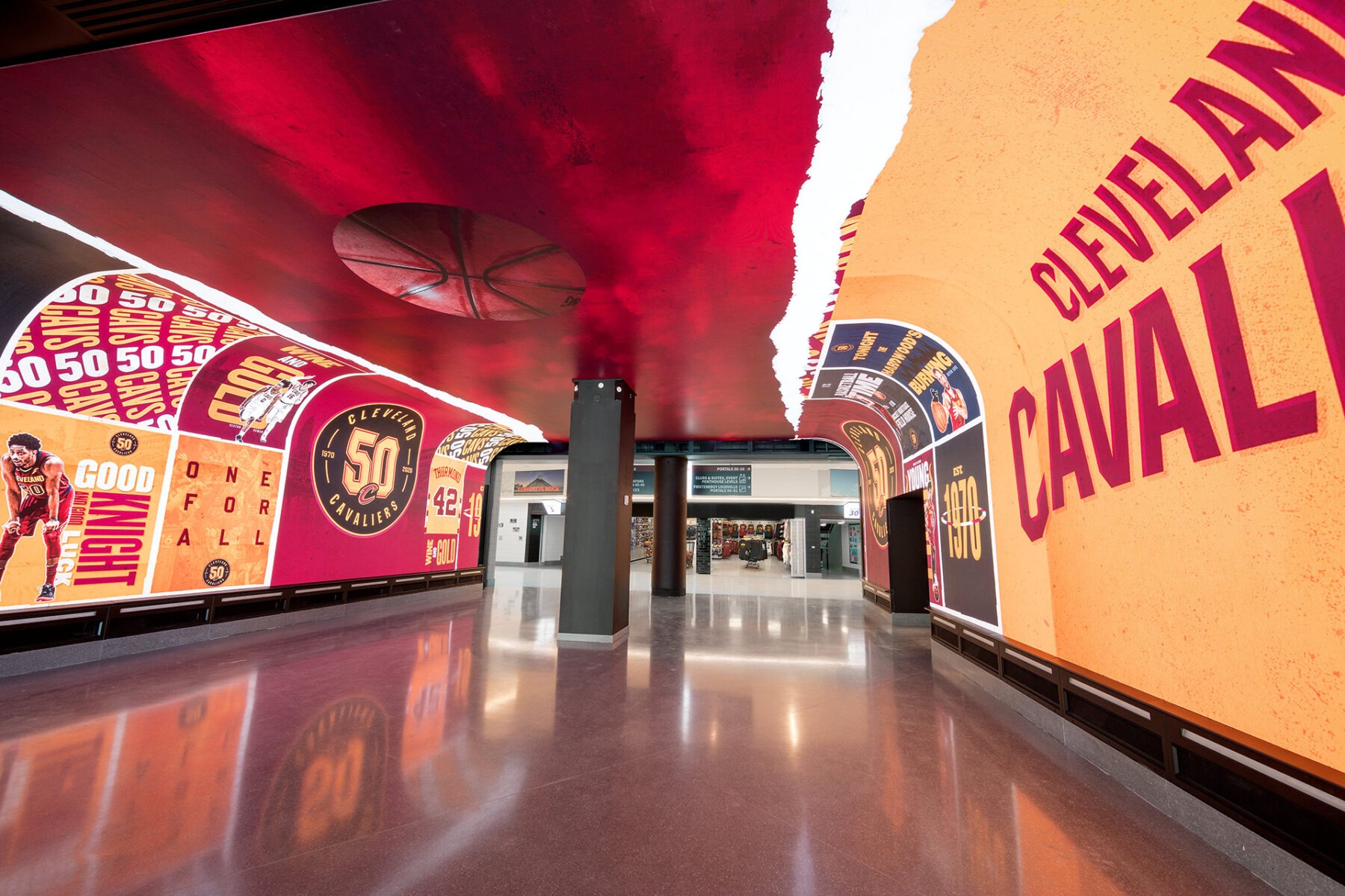 An indoor walkway/tunnel with 360 degree digital displays showing Cleveland Cavalier graphics
