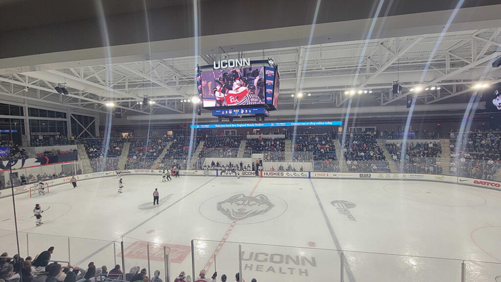Digital scoreboard displaying video during a hockey game at the Toscano Family Ice Forum