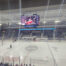 Digital scoreboard displaying video during a hockey game at the Toscano Family Ice Forum