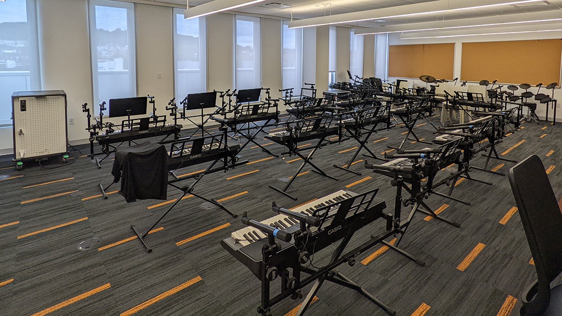 Rows of keyboards in a music classroom